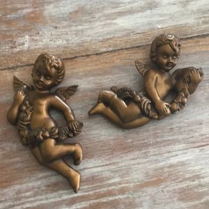 Pair of signed, vintage ceramic cherubs